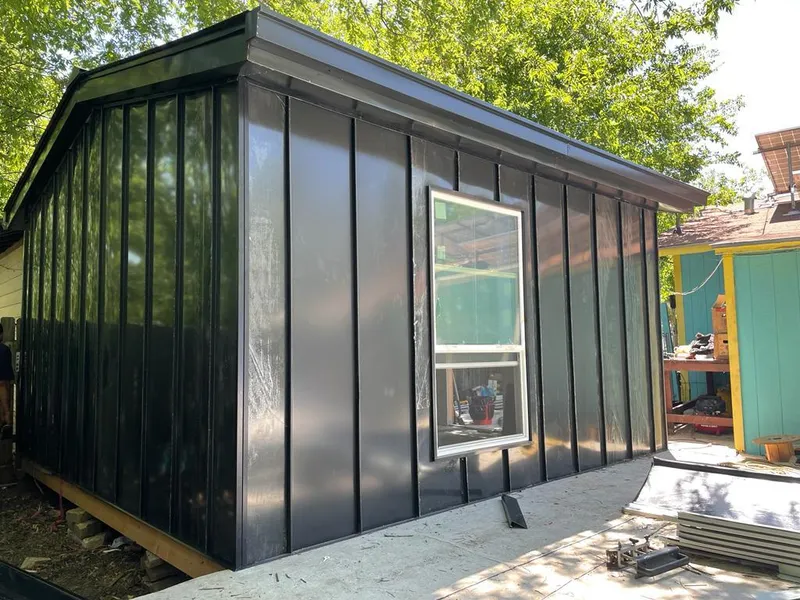 Black standing seam metal wall panels for Roof Inspection in Eastmont