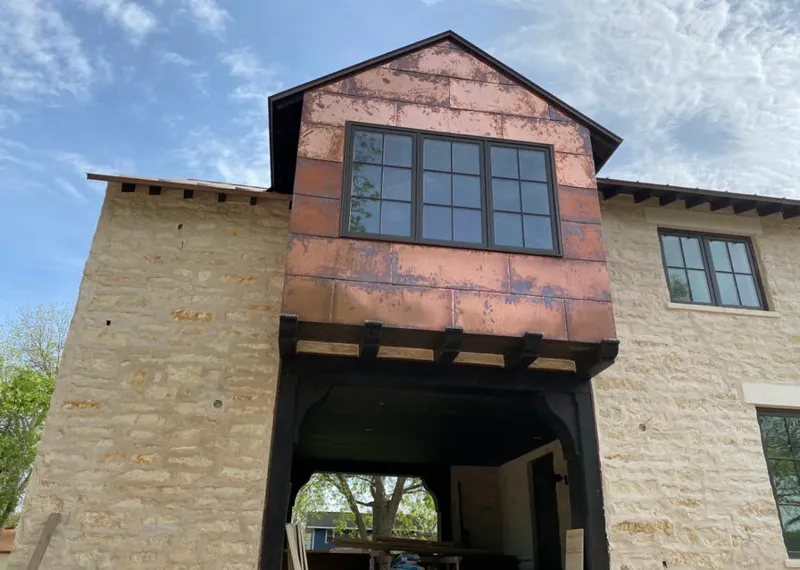 Copper metal panel facade on a stone building for Metal Roof Coating in Eastmont